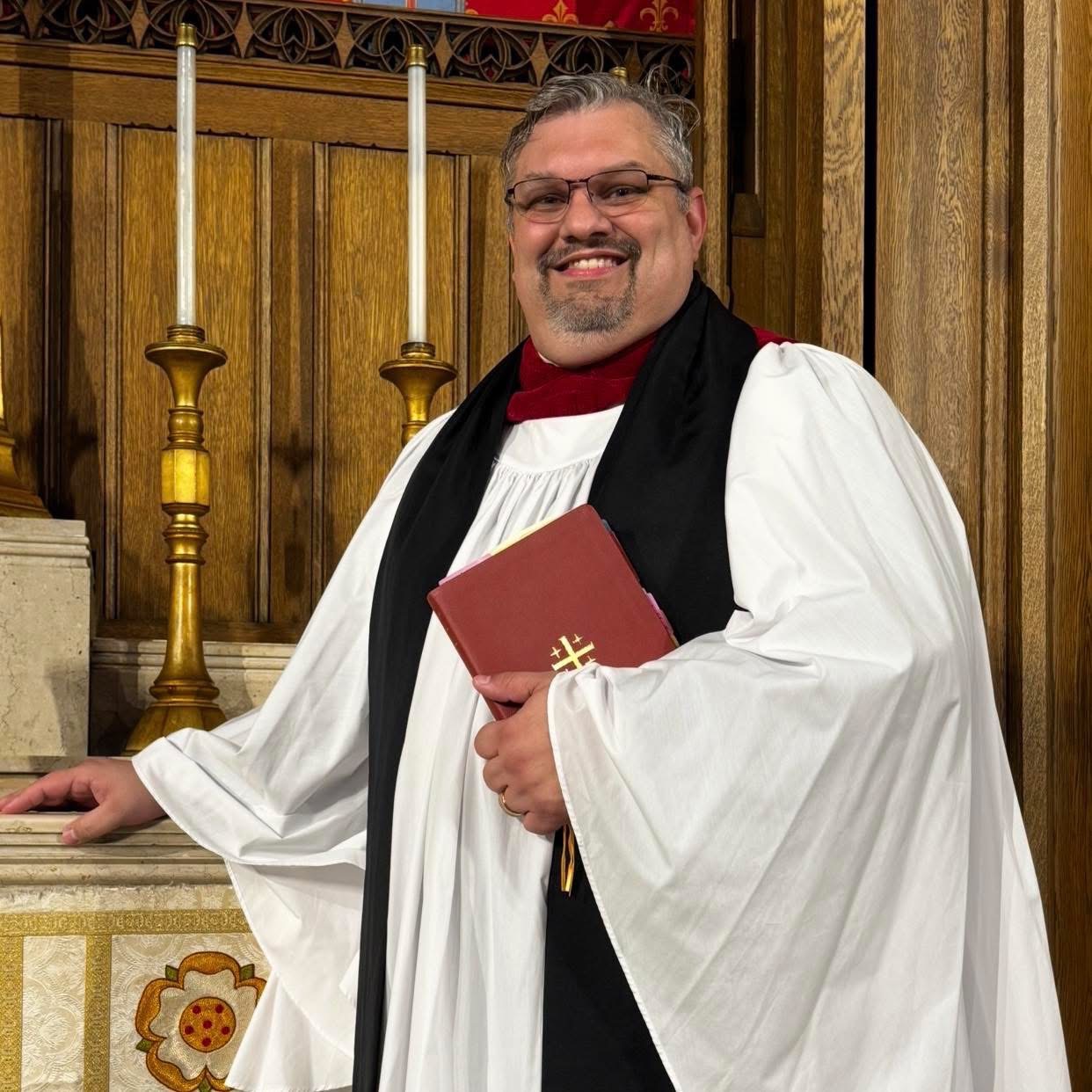 The Very Reverend Canon Liam Helms, Dean of the Pro-Cathedral, vested in surplice and tippet